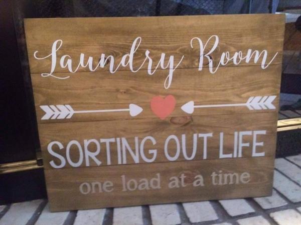 Laundry room sorting out life one load at a time with arrows