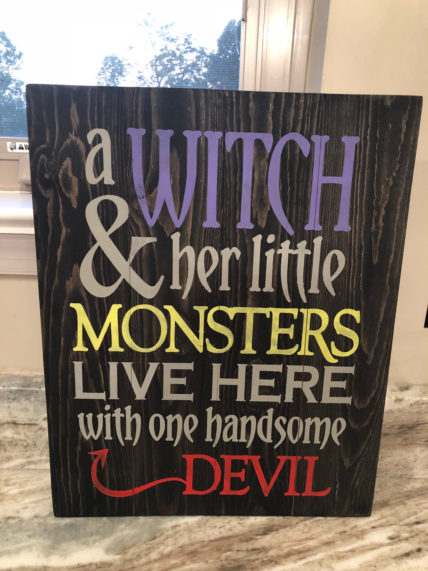 a witch and her little monsters