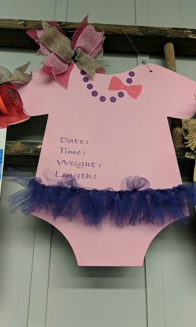 Door hanger baby girl onesie