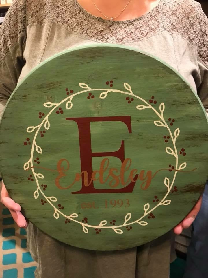 Family name with Initial EST with wreath (last name with tails)