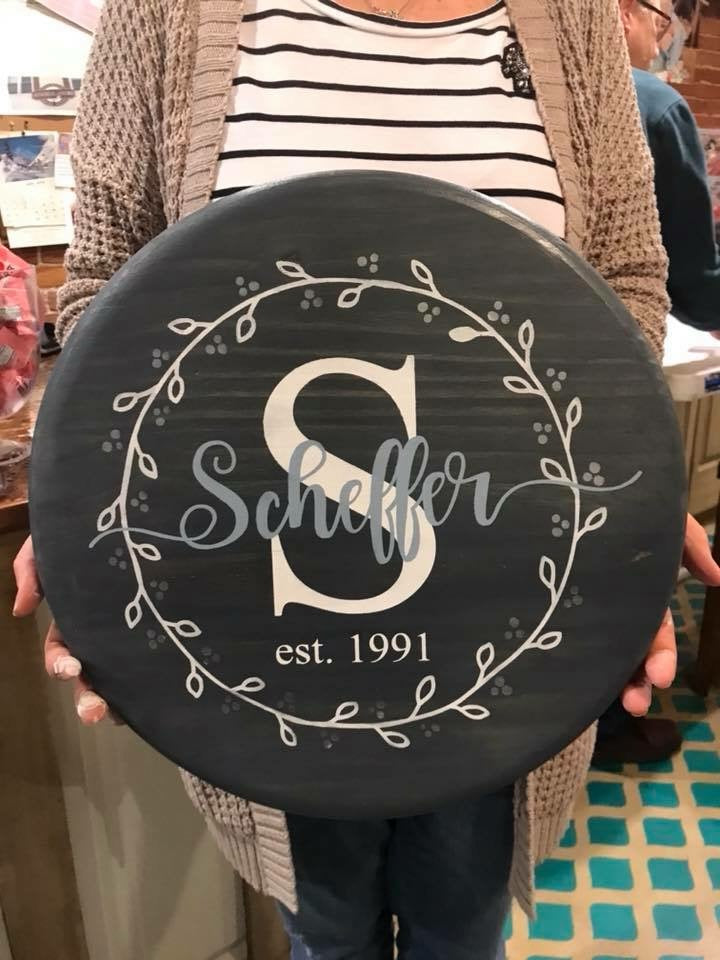 Family name with Initial EST with wreath (last name with tails)