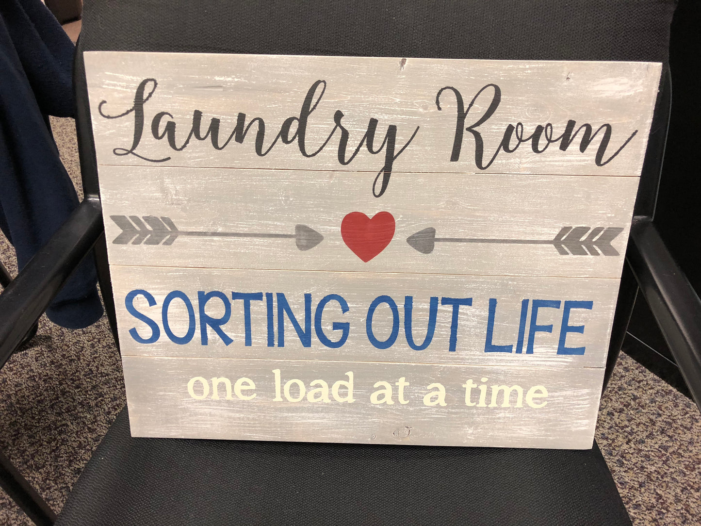 Laundry room sorting out life one load at a time with arrows