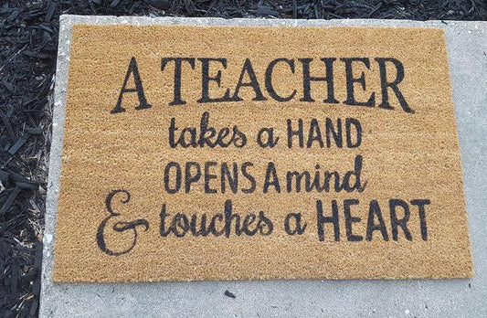 A teacher takes a hand opens a mind and touches a heart