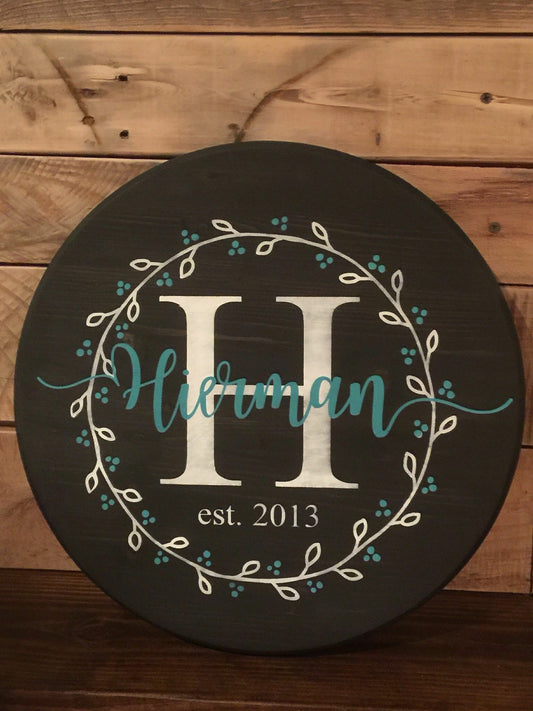 Family name with Initial EST with wreath (last name with tails)